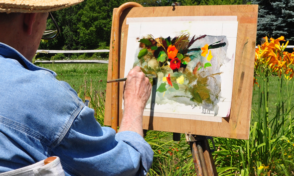 Richard painting in his garden